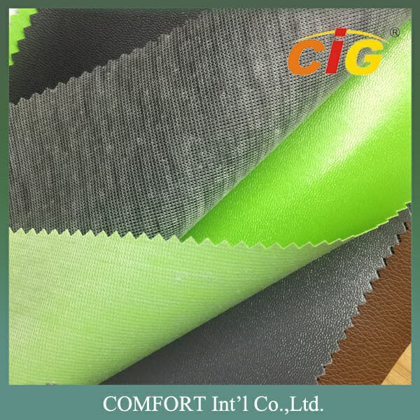 Amostras de tecidos em tons de verde e cinza sobrepostos, apresentando diferentes texturas e acabamentos.