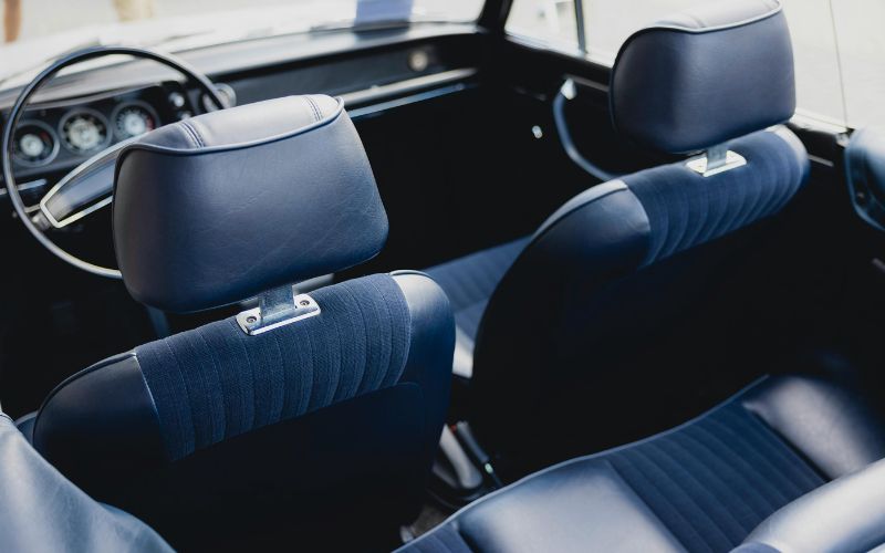 Premium car interior with plush blue seats and ergonomic design for ultimate comfort and relaxation. Perfect for long drives and daily commutes, ensuring a cozy and stylish ride.